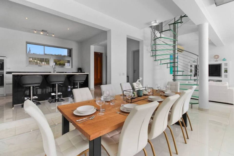 Dine in style with our villa`s spacious dining area, featuring a large table perfect for gatherings and enjoying delicious meals. Soak up the natural beauty of the surroundings with ample natural light.