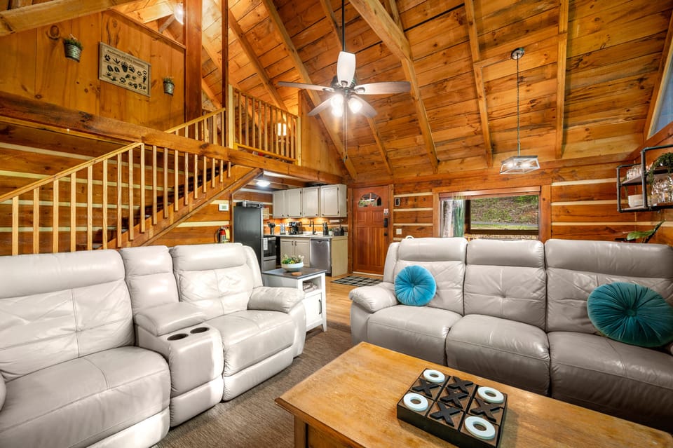 Loft bedroom overlooking living room.