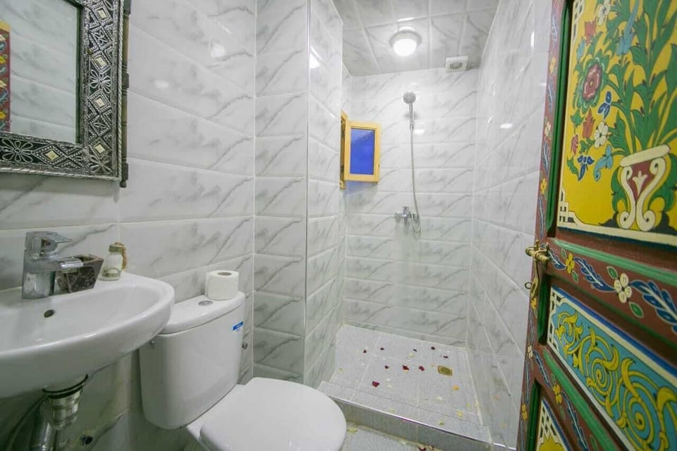 Shower, free toiletries, hair dryer, slippers