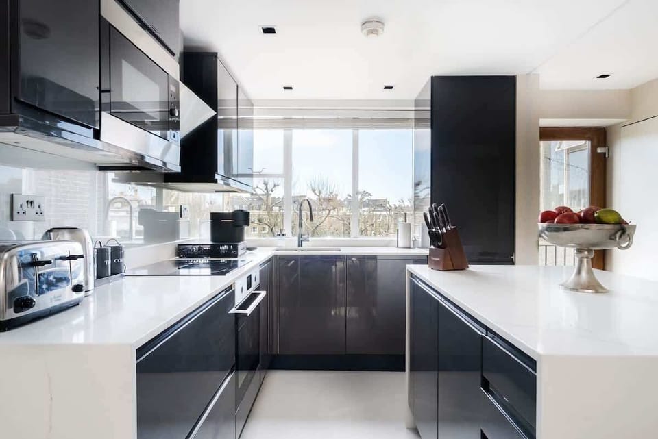Full Kitchen | Our kitchen is fully equipped with a stylish island and stools. It includes a washing machine, dryer, dishwasher, microwave, Nespresso machine, and a fresh water dispenser.