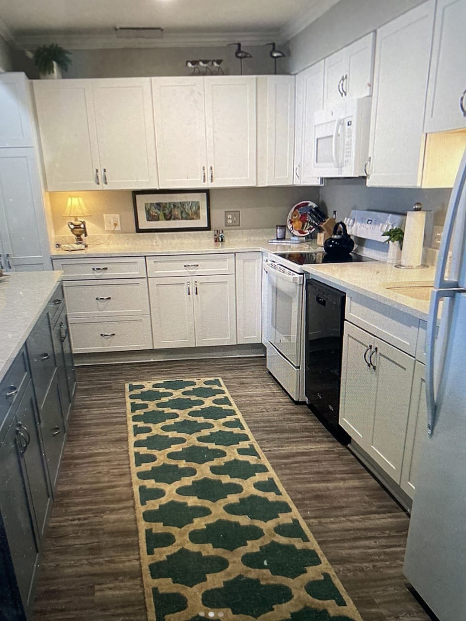 Fully equipped kitchen includes drip and pod coffee makers.