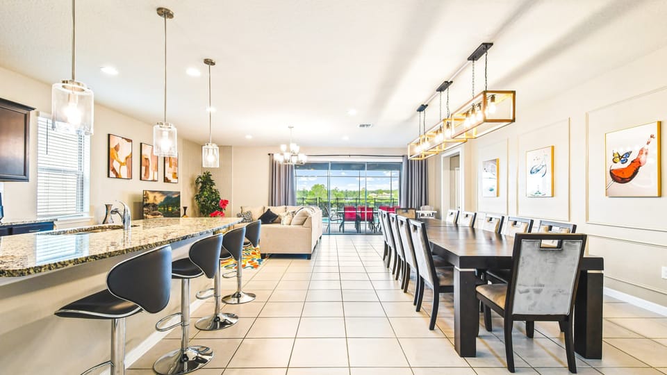 Elegant dining space with chic lighting, modern art, and seating for the whole group!