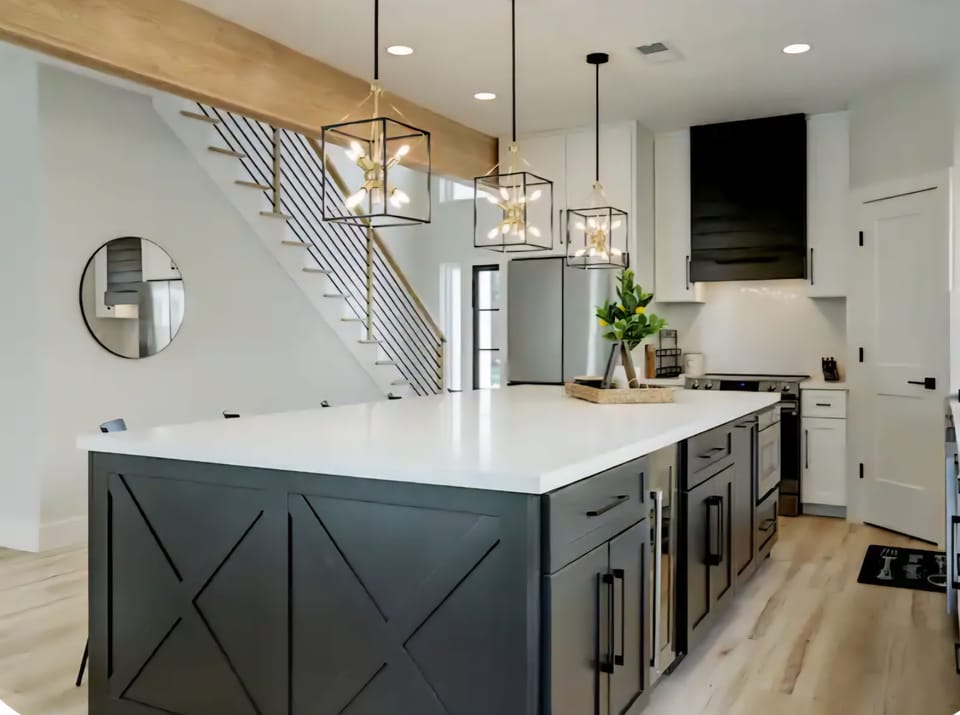 Chef’s kitchen featuring a stunning 10ft quartz island, stocked with essentials 