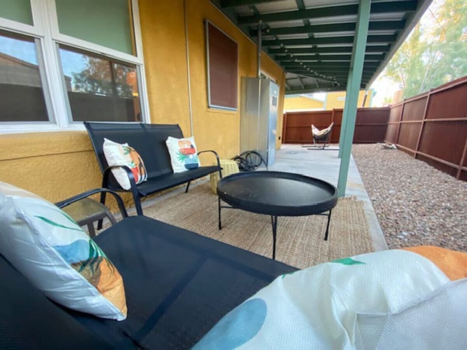 Covered patio with plenty of comfortable seating