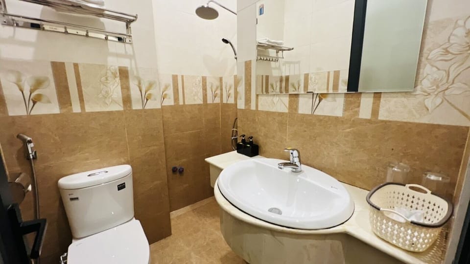 Separate tub and shower, hydromassage showerhead, hair dryer, bathrobes