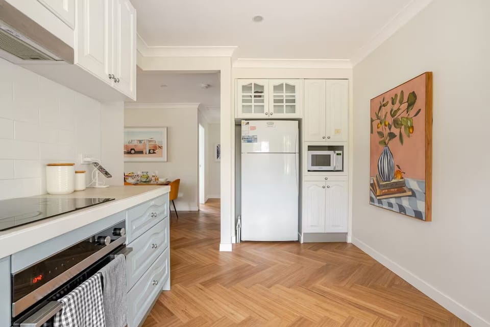 Large Fridge, microwave & guest pantry where you will find cooking essentials