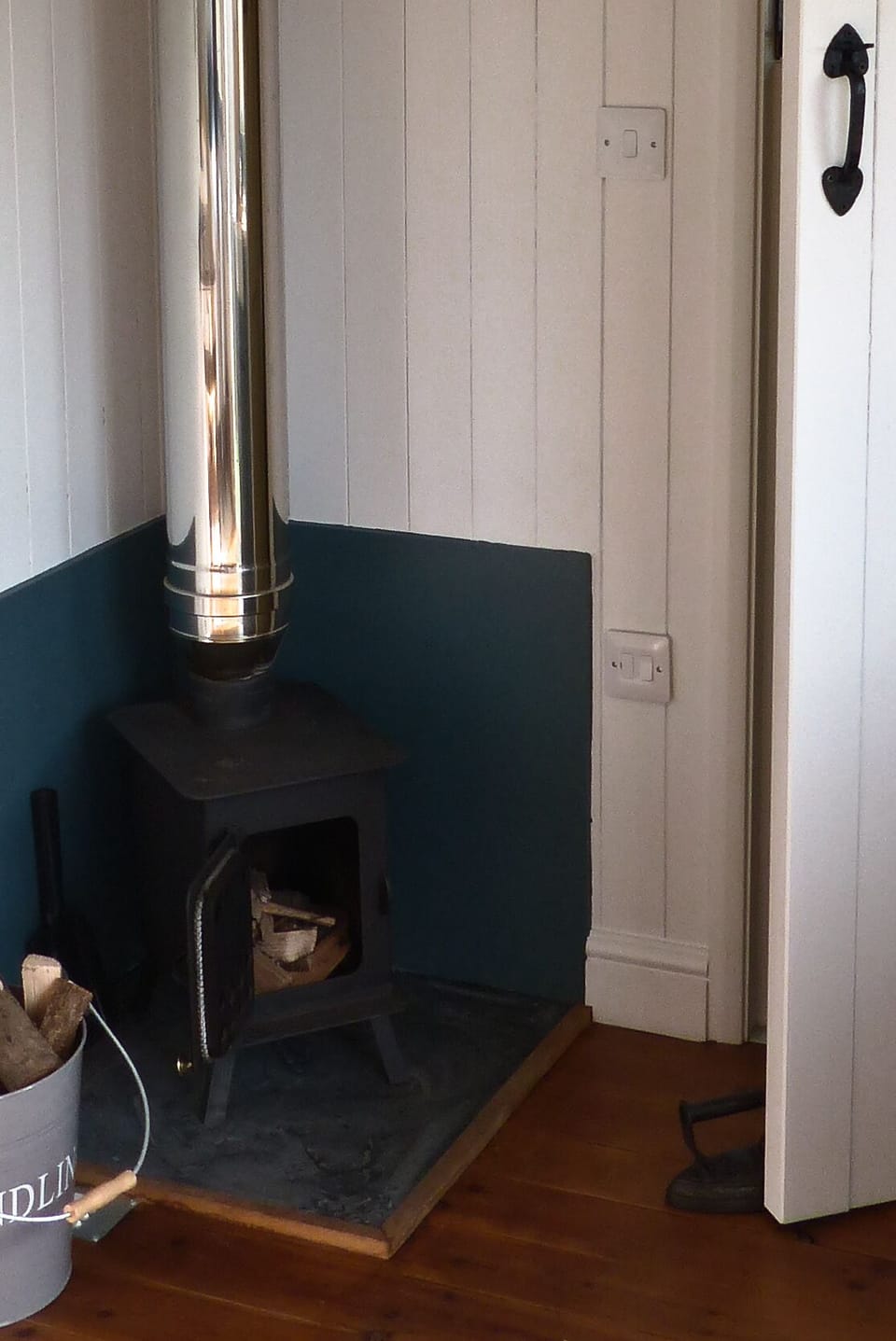 Wood burner with logs provided