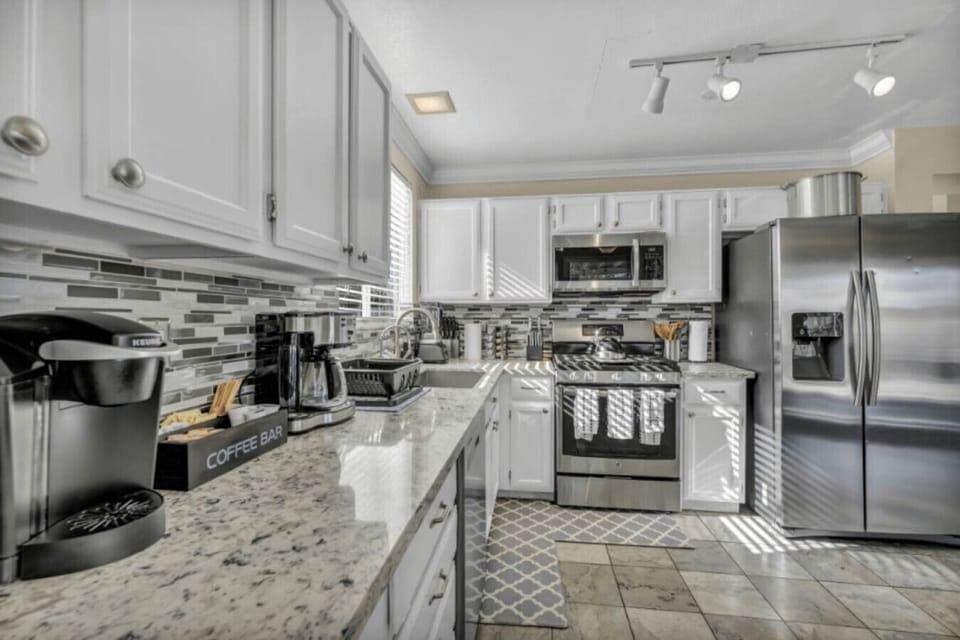 The fully equipped kitchen features Fridge, Stove, Microwave, Dishwasher, Keurig coffee machine, dripping coffee machine, pots pans and all the essentials to share a delicious meal with your friends and family