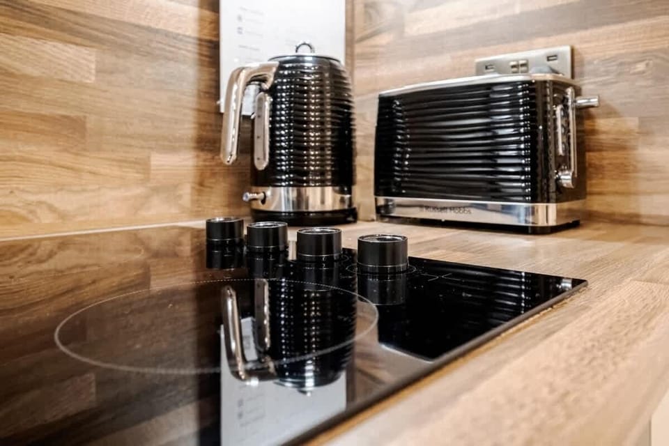 Full Kitchen | A fully equipped kitchen designed for your convenience, featuring everything you need, including a filtered fresh water dispenser (with hot and cold options), an espresso coffee machine, a dishwasher, and a washing machine/dryer
