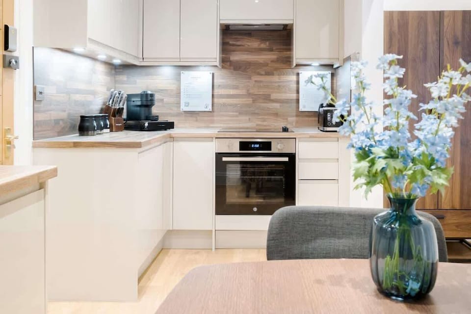Full Kitchen | fully equipped kitchen designed for your convenience, featuring everything you need, including a filtered fresh water dispenser (with hot and cold options), an espresso coffee machine, a dishwasher, and a washing machine/dryer