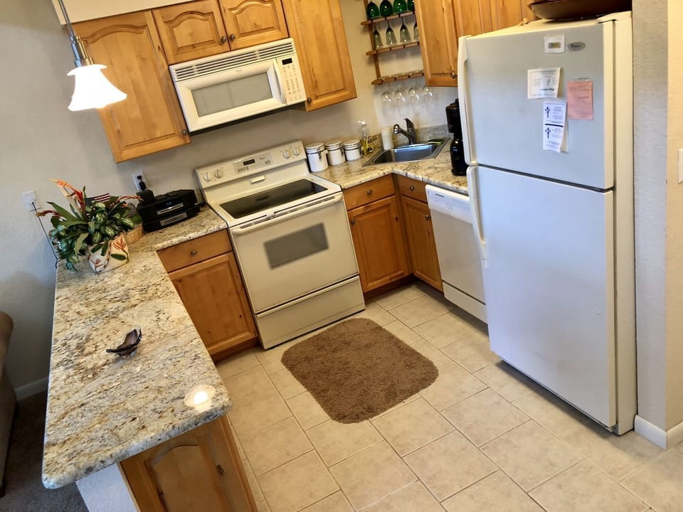 Kitchen is fully stocked for any meal.  Full size fridge and granite countertops