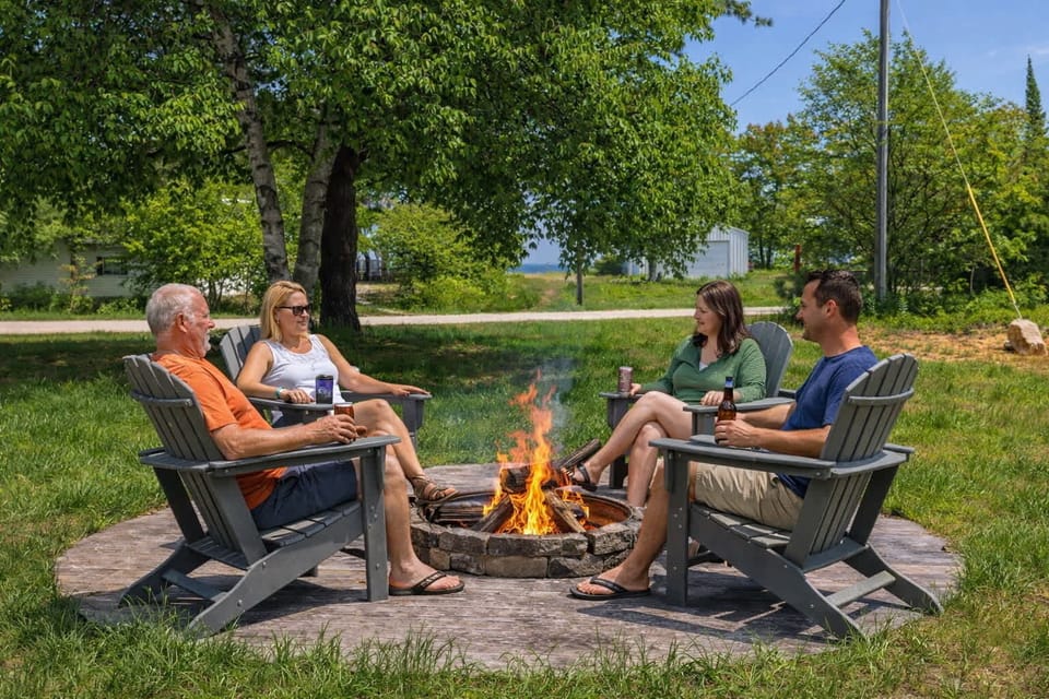 Front yard firepit with Adirondack chairs, pull up a seat after dark and let the UP sky take over — zero light pollution overhead