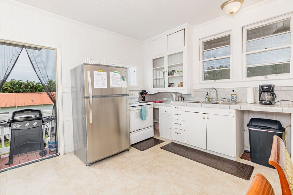 Right off the kitchen is a door to the back stairs which holds the grill