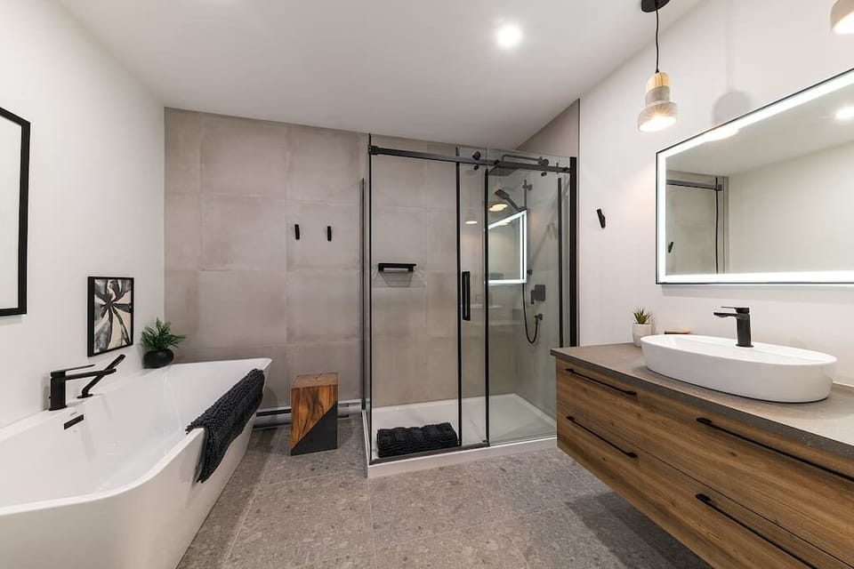 Bathroom with bathtub and shower