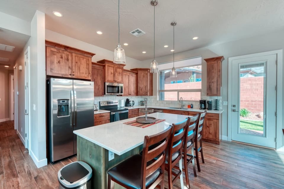 Start your day with a cup of coffee or tea at the kitchen island, or step outside to the tranquility of the backyard.
