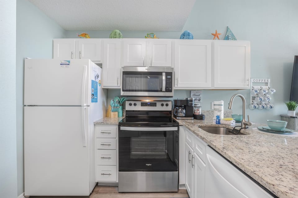 Vacation made easy with a fully stocked kitchen featuring all new appliances and counters
