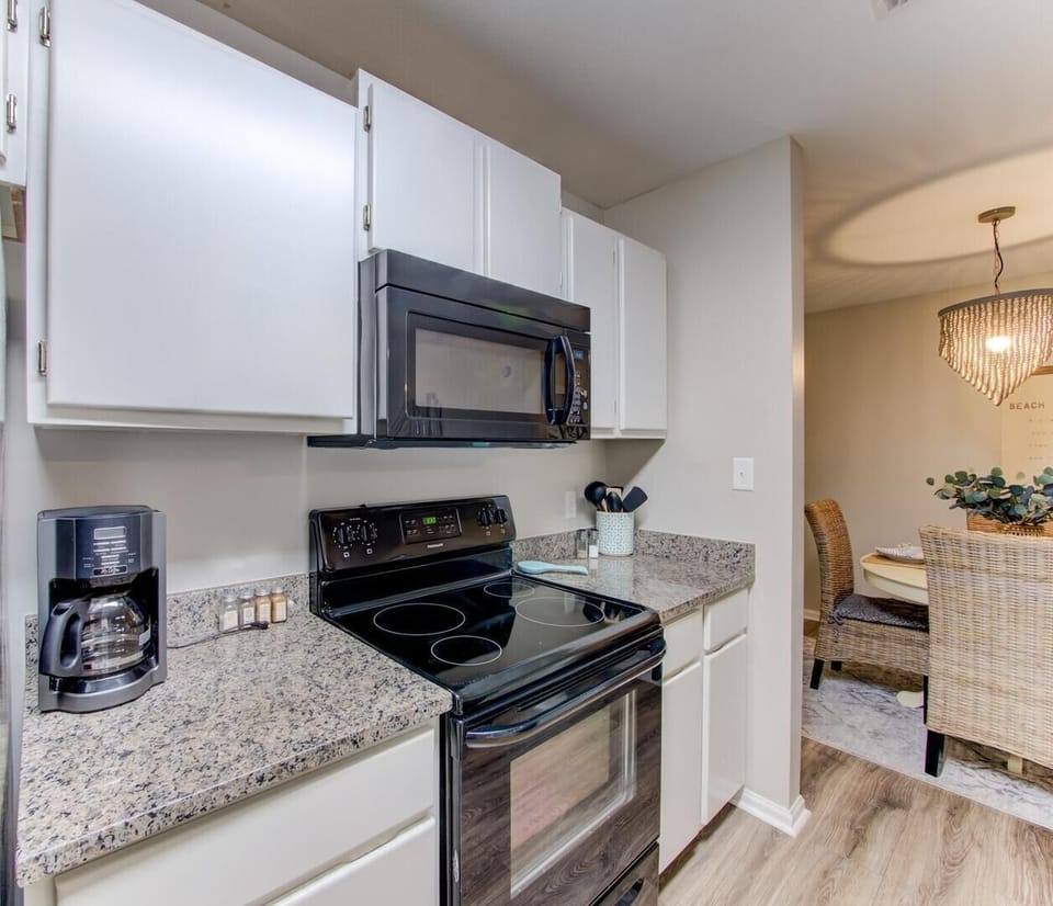 Condo, Multiple Beds, Balcony | Private kitchen | Fridge, microwave, oven, stovetop