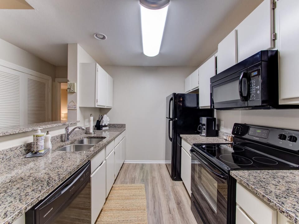 Condo, Multiple Beds, Balcony | Private kitchen | Fridge, microwave, oven, stovetop