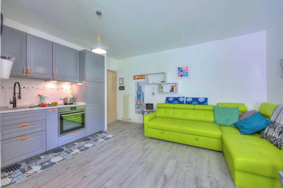 Family Apartment, Multiple Bedrooms (Marina's Green Home) | Living area | 21-inch Smart TV with digital channels