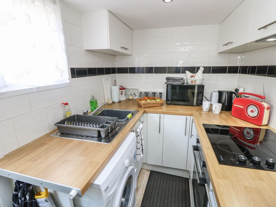 Fridge, electric kettle, toaster, cookware/dishes/utensils