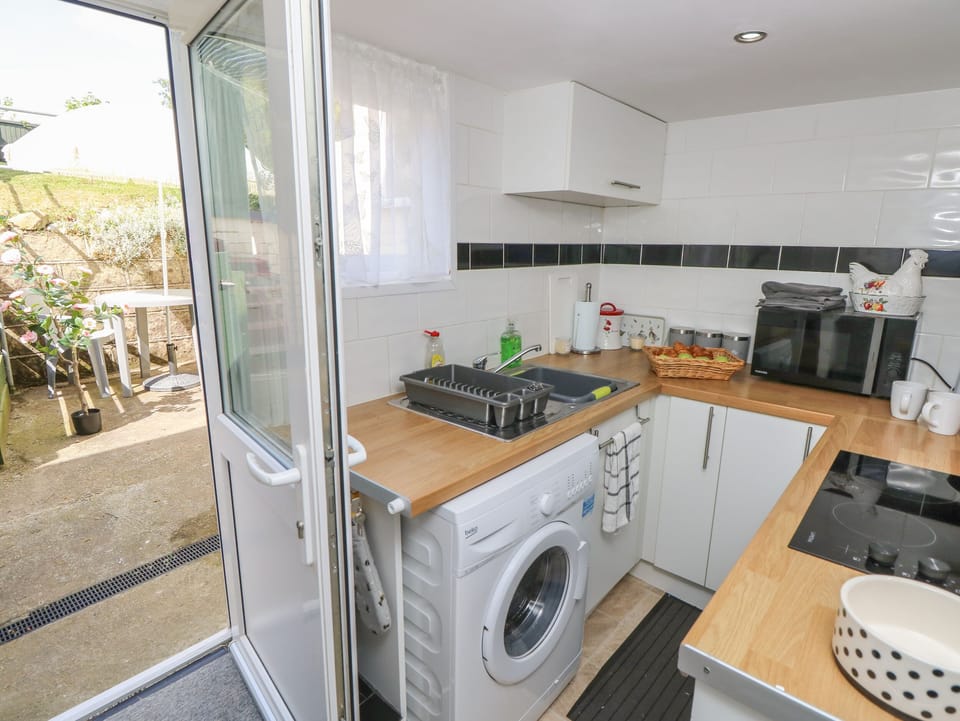 Fridge, electric kettle, toaster, cookware/dishes/utensils