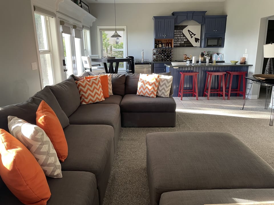 Downstairs living room and kitchen.  Couch can seat 10 people