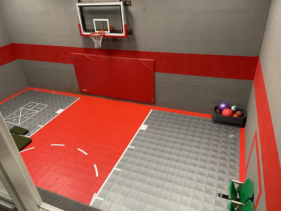 View of the sport court from the window in the weight room 