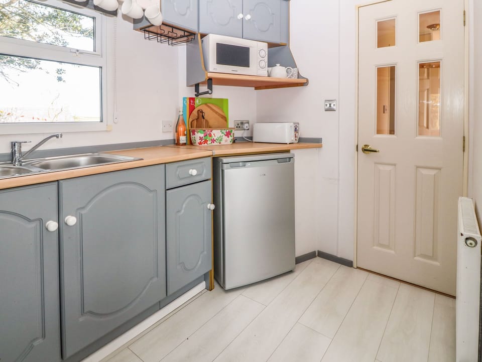 Fridge, electric kettle, toaster, cookware/dishes/utensils