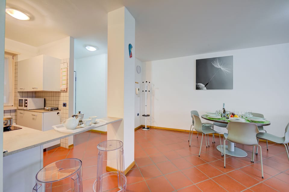 The living room with separate kitchen
