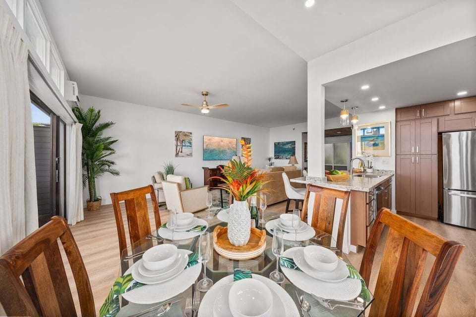 Stylish interior dining area with seating for six, set beside the renovated kitchen and living space for effortless group meals.