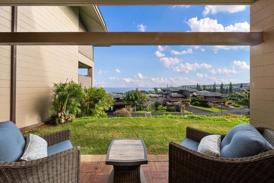 Covered lanai off the primary bedroom offering scenic resort and partial ocean views, ideal for morning coffee or evening sunsets.
