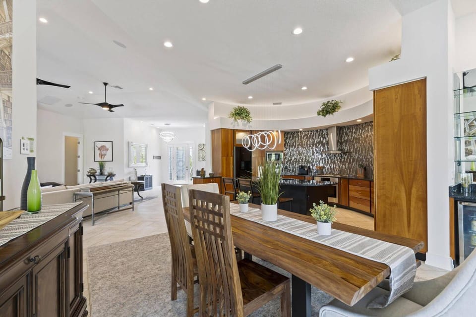 Timeless Elegance: Wood Dining Table, Wine Bar & Window Seating for a Sophisticated Home