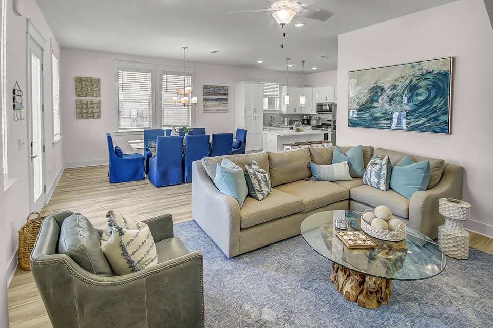 Beautifully decorated open-concept living, kitchen, & dining area, you will notice there is more than enough seating to accommodate everyone