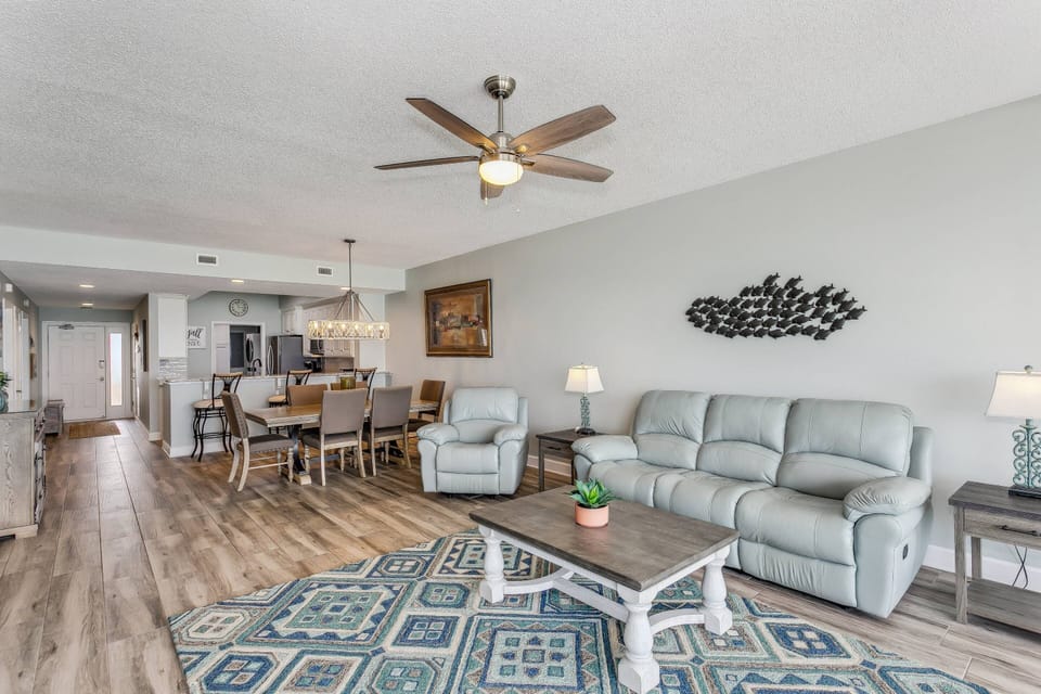 Open living and dining area with high end tile flooring
