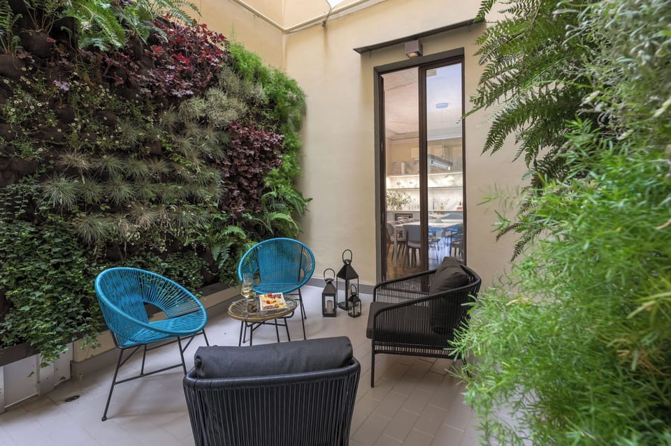 Outdoor private courtyard with table and chairs for the perfect al fresco drink