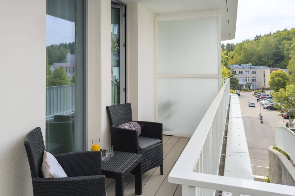 The balcony provides a perfect spot for evening relaxation. 