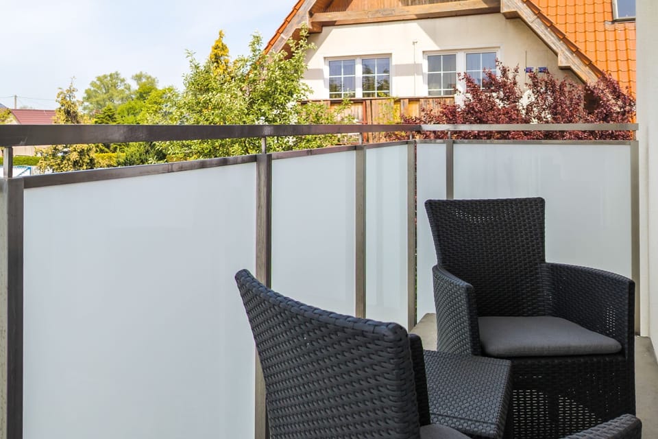 Relax on the balcony's comfortable chairs and enjoy the fresh air.