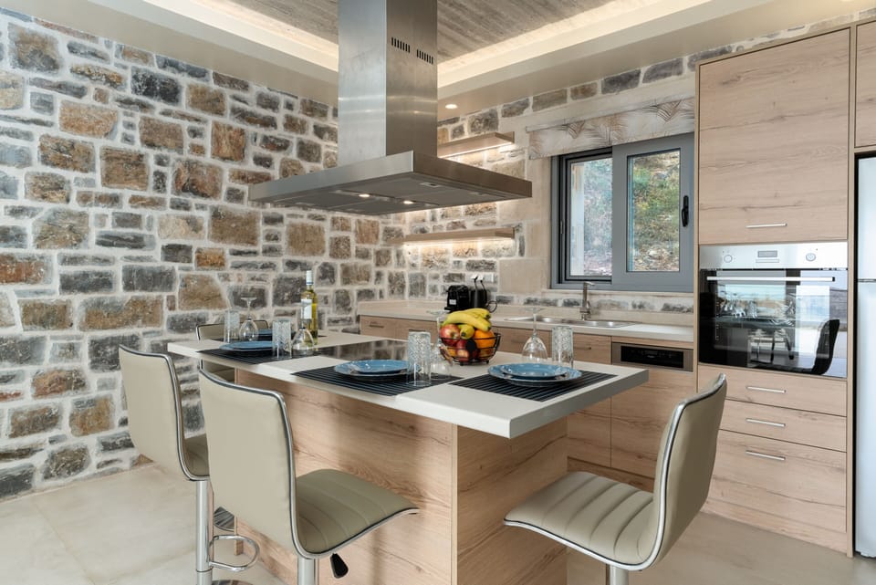 The kitchen counter with chairs