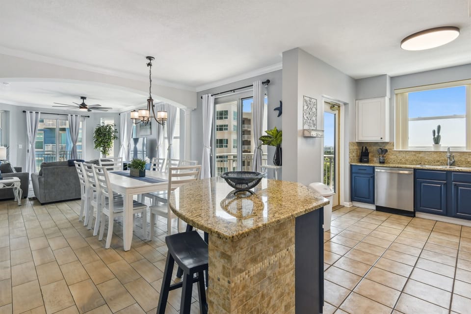 Looking into the kitchen, dining, living. Kitchen balcony off the kitchen.