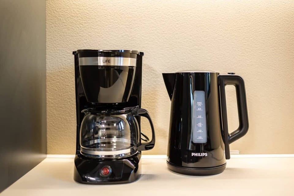 Coffee Station with Espresso Maker and Cups – Everything you need for your morning coffee ritual.