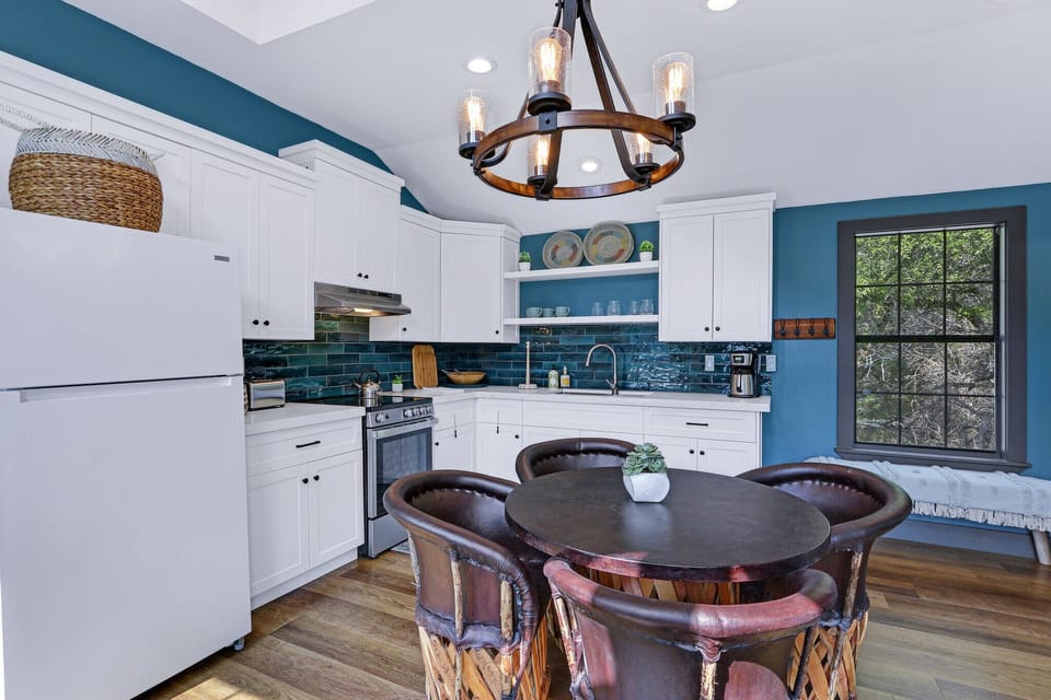 Kitchen with refrigerator and range/oven combo.