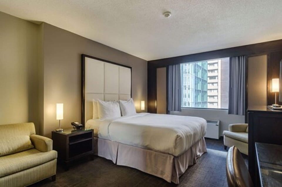 Intimate Queen Room | Premium bedding, memory foam beds, in-room safe, desk