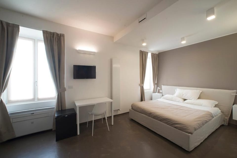 Superior Quadruple Room | Down comforters, minibar, individually decorated, individually furnished