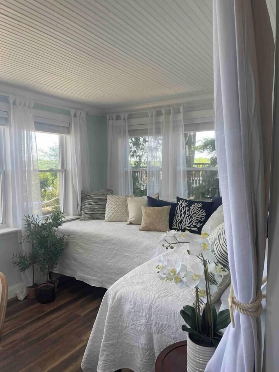 This bedroom area has curtains. It is with the dining room table . The curtains can be pulled for privacy. The view is amazing! 