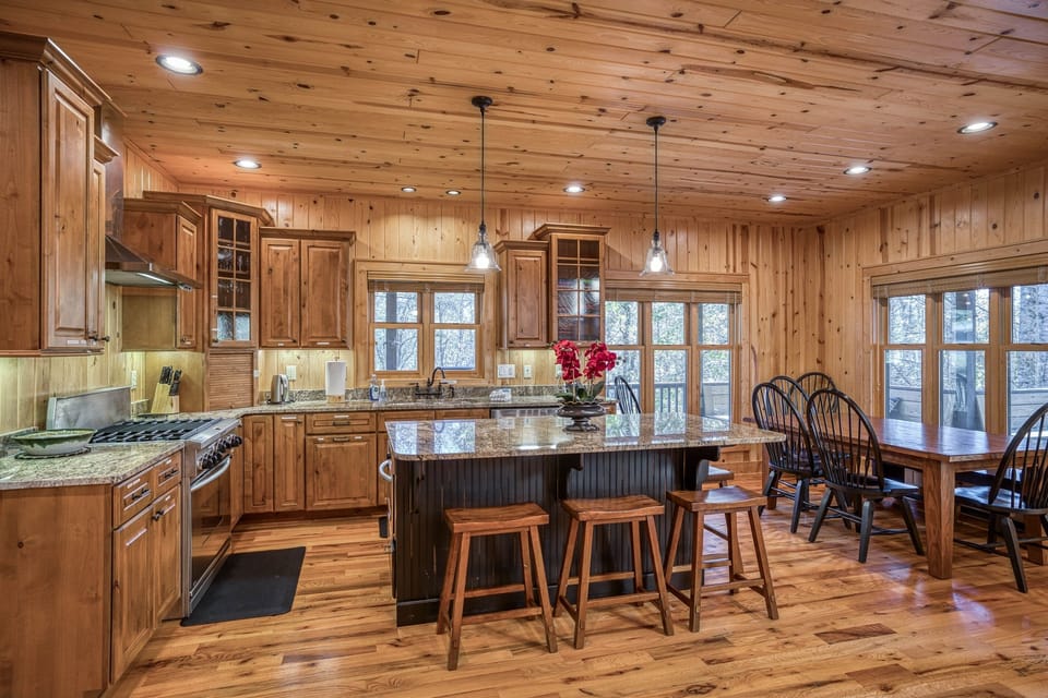 Expandable dining room table seats 6-8, with seating for 4 more at the island