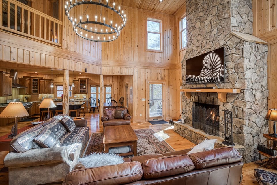 Open-concept main floor with massive wood-burning fireplace