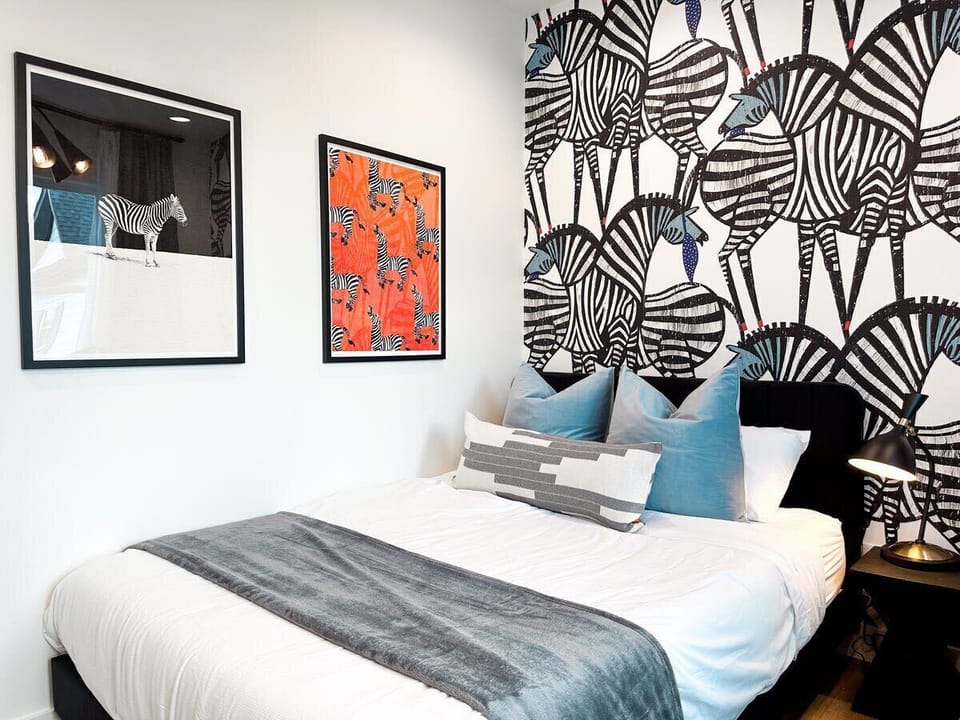 The striking Zebra room features a queen sized bed and a twin sized daybed with memory foam mattresses in an elaborate composition of stripe patterns and complimentary hues. 