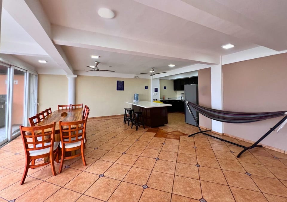 Full-size fridge, dishwasher, cookware/dishes/utensils, paper towels