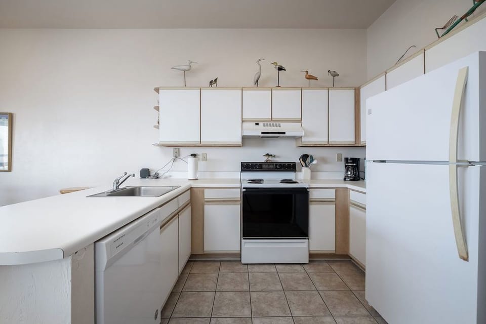 Fully Stocked Kitchen Equipped with Dishwasher
