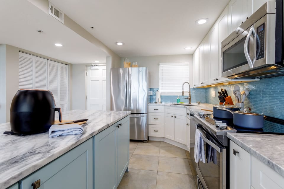 Paloma Penthouse offers a newly renovated, fully stocked luxury kitchen with premium appliances and all the amenities of home.  Cookware, bakeware, dishware, flatware and barware...we've got you covered. 
 Cheese slicer?  Check.  Corkscrew?  Check.  Air fryer?  Check.  Rice Cooker? 
 Check.  You get the idea.